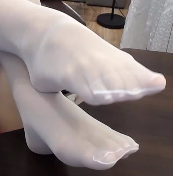 Sexy feet in sheer white pantyhose